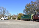 Now the diesel consist gets its turn-proud 2003 leads the train toward the Bailey St grade crossing 